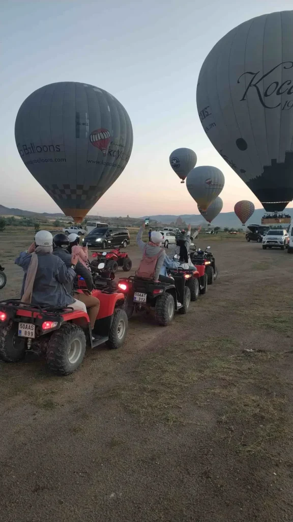 ATV riders watching hot air balloons in Cappadocia
