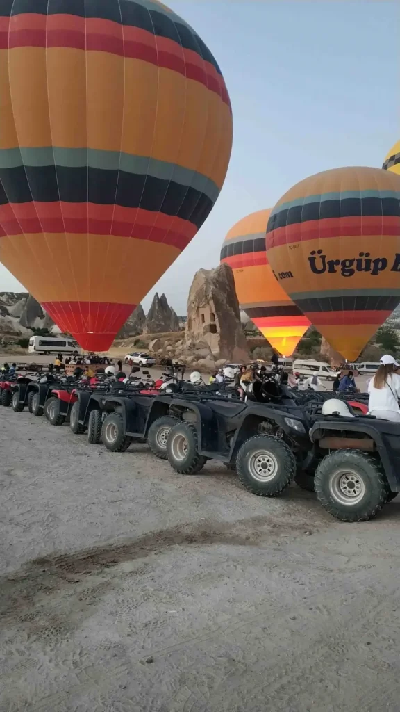 Cappadocia ATV tour beside hot air balloons