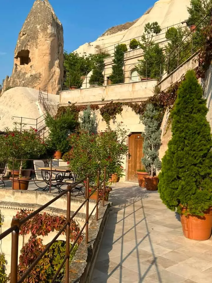 Cave hotel terrace and rock-cut room in Cappadocia